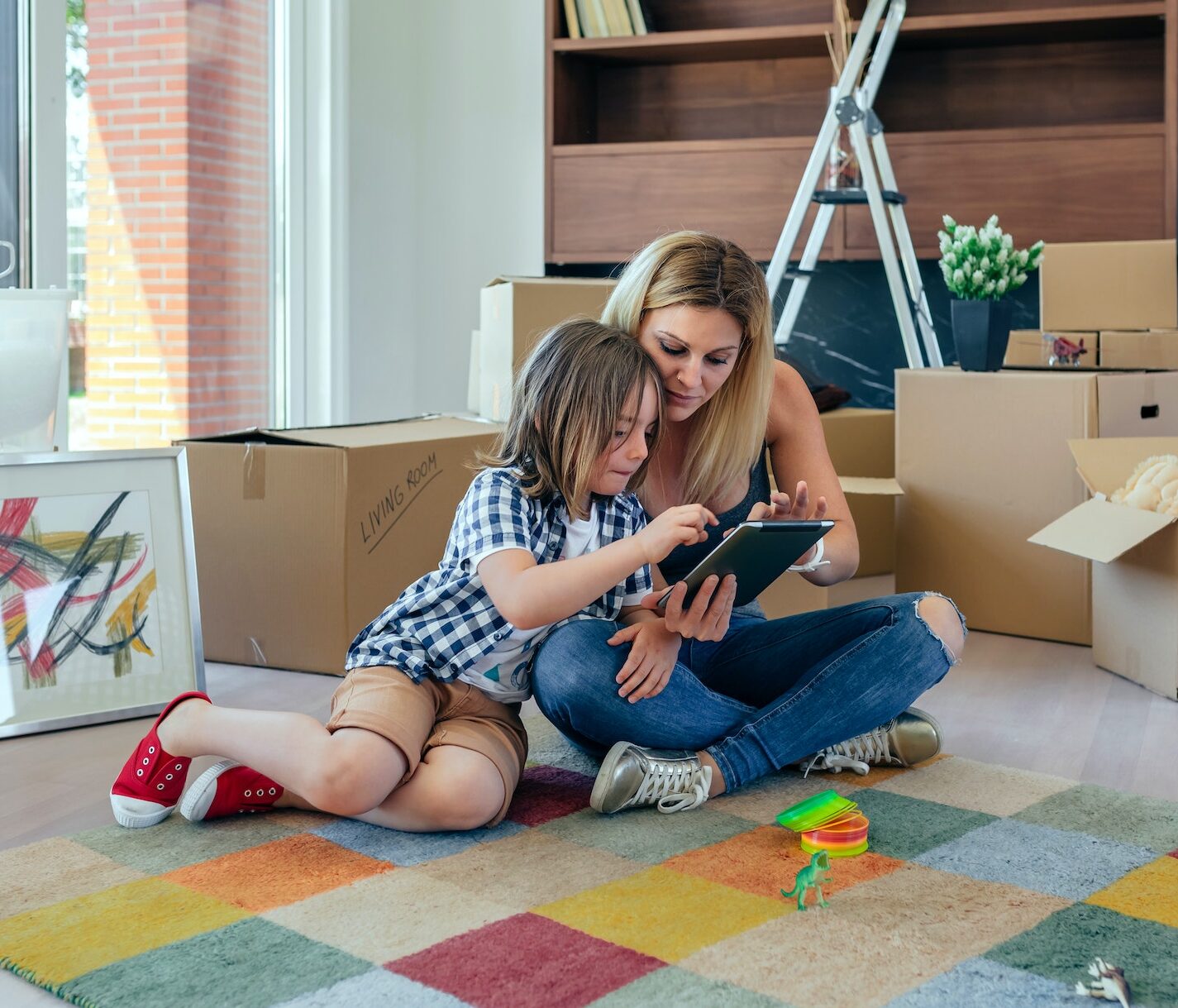 Mother and son playing the tablet